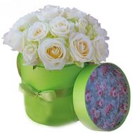 Delicate white roses in a box