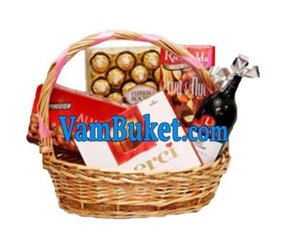 Basket with sweets and wine