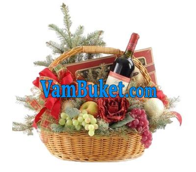 A fruit basket for the New Year with flowers and a Christmas tree